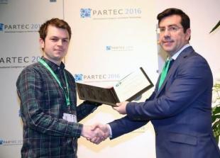 Christopher Ness receiving the triennial EFCE Excellence Award in Mechanics of Particulate Solids